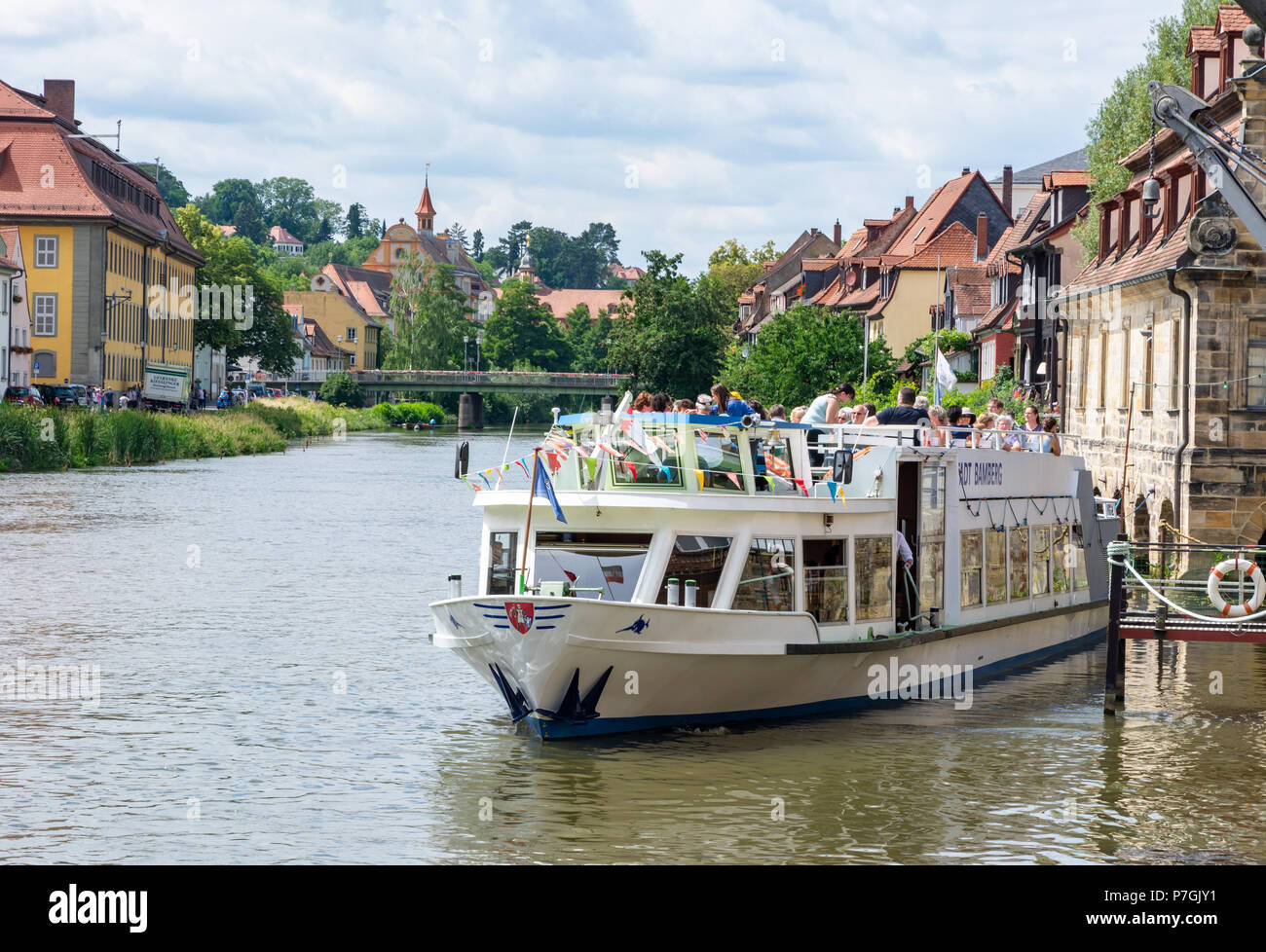 BAMBERG, GERMANY - JUNE 19: Tourists on a passenger ship at river Regnitz in Bamberg, Germany on June 19, 2018. Stock Photo