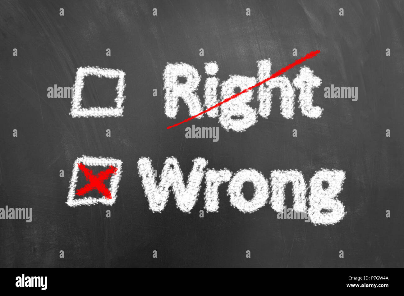 Crossed right and wrong chalk text on chalkboard or blackboard as ethics bad decision answer mistake concept Stock Photo