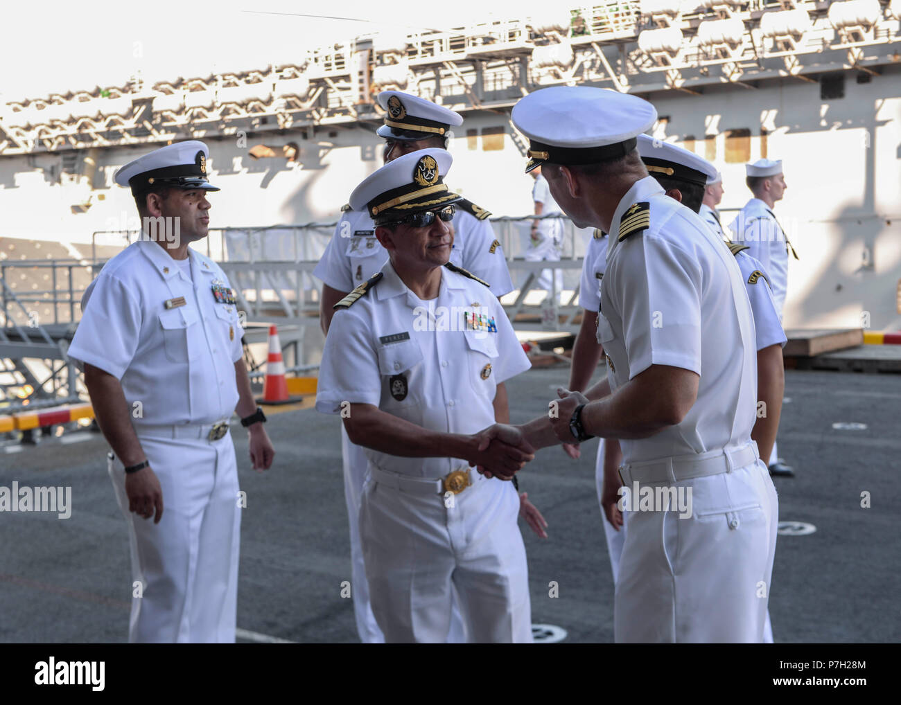 180627-N-PX867-093 SAN DIEGO (June 27, 2018) Mexican Navy Capt. Jose Enrique Perez Munoz is welcomed on the quarter deck by Capt. Ronald A. Dowdell, executive officer of amphibious assault ship USS Boxer (LHD 4), during the Southern California portion of the Rim of the Pacific (RIMPAC SOCAL) opening reception June 27. Twenty-five nations, more than 45 ships and submarines, about 200 aircraft, and 25,000 personnel are participating in RIMPAC from June 27 to Aug. 2 in and around the Hawaiian Islands and Southern California. The world’s largest international maritime exercise, RIMPAC provides a u Stock Photo
