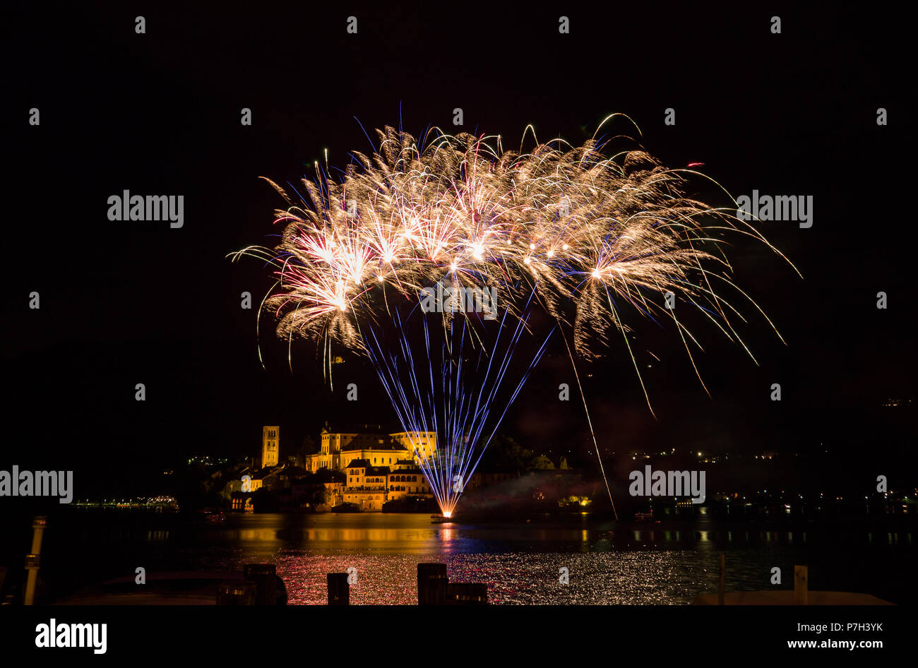 beautiful colorful fireworks display on the Orta Lake island. Piedmont,Italy Stock Photo