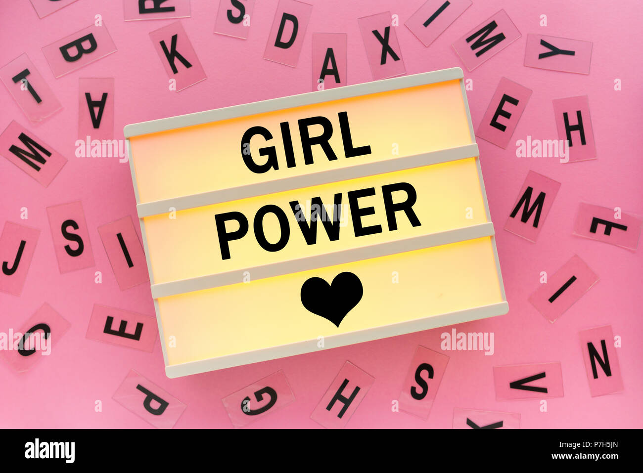Girl power concept with text on lightbox Stock Photo