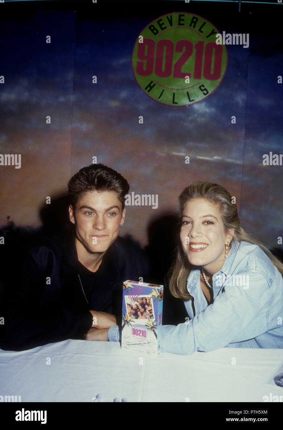 NORTHRIDGE, CA - JANUARY 25: (L-R) Actor Brian Austin Green and actress Tori Spelling attend the launch of the release of 'Beverly Hills, 90210' series pilot on video on January 25, 1992 at the Wherehouse in Northridge, California. Photo by Barry King/Alamy Stock Photo Stock Photo