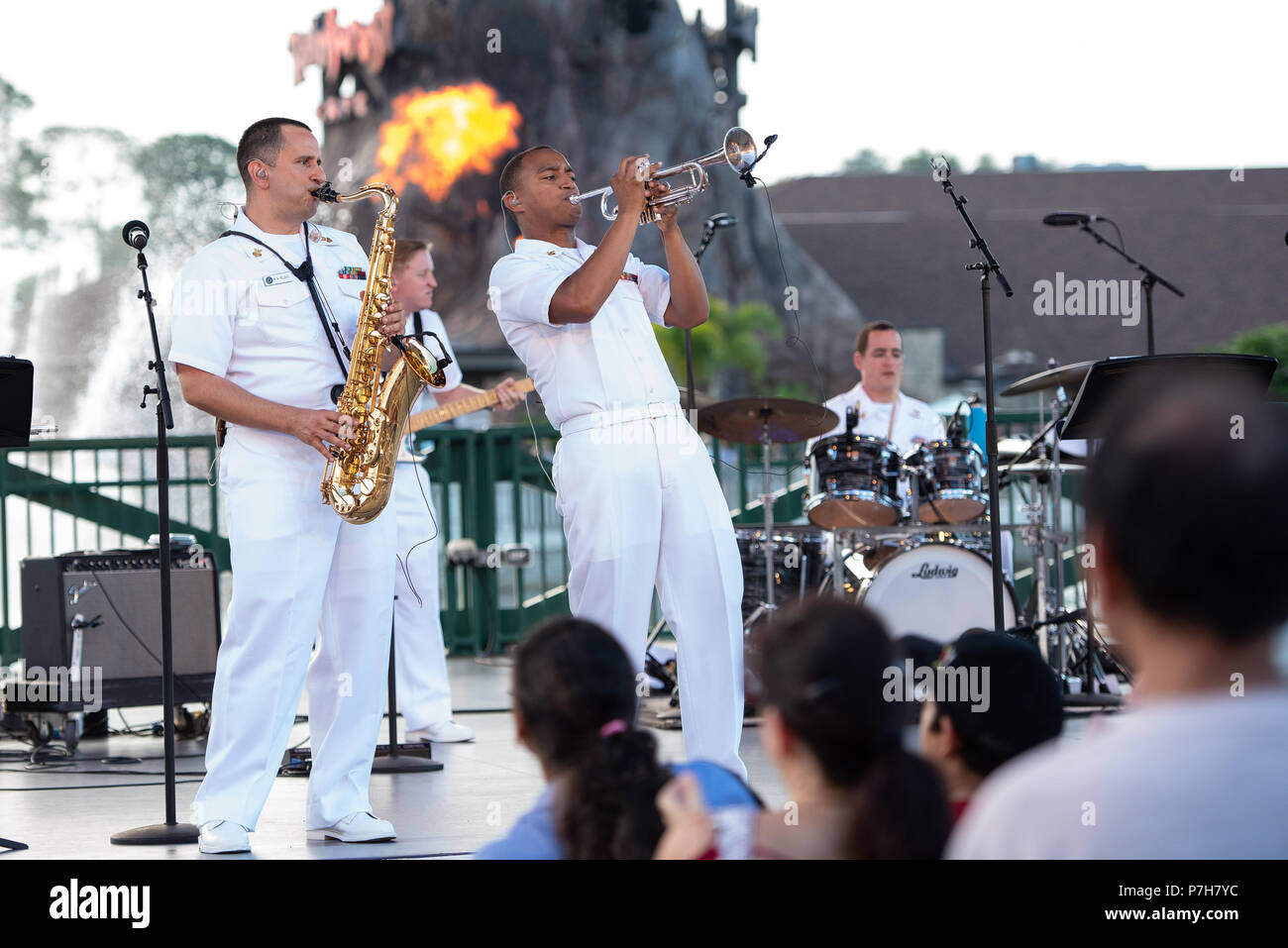 LAKE BUENA VISTA, Fla. (July 2, 2018) Musicians 1st Class Manuel Pelayo de Gongora, left, and David Smith, perform with the U.S. Navy Band Cruisers during a concert at the Disney Springs Marketplace Stage in Lake Buena Vista, Florida. The Navy Band performed in seven cities in Florida, connecting communities to the Navy and building awareness and support for the Navy. (U.S. Navy photo by Senior Chief Musician Adam Grimm/Released) Stock Photo