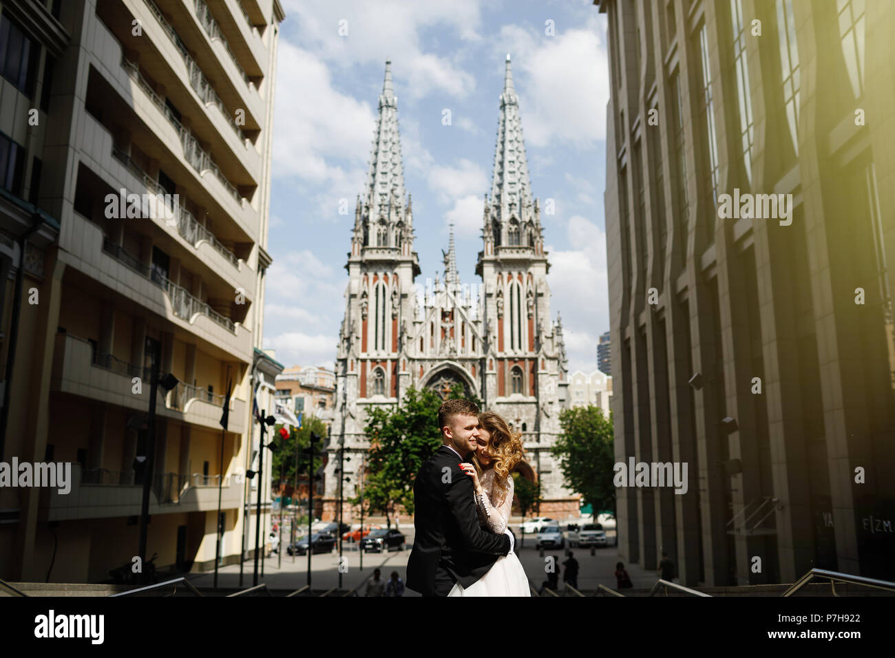 bride and groom posing on the streets of the old city Stock Photo - Alamy