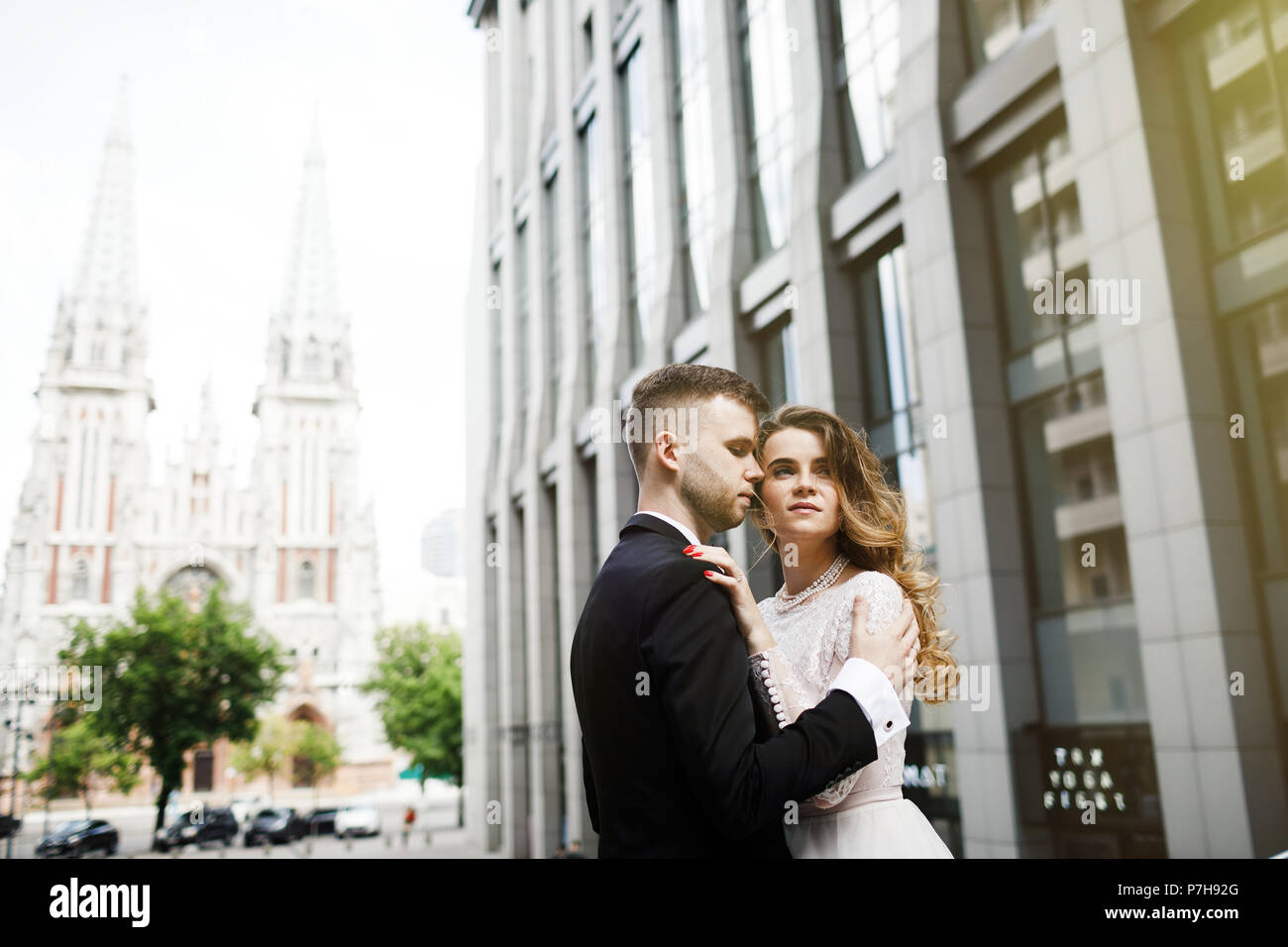 bride and groom posing on the streets of the old city Stock Photo - Alamy