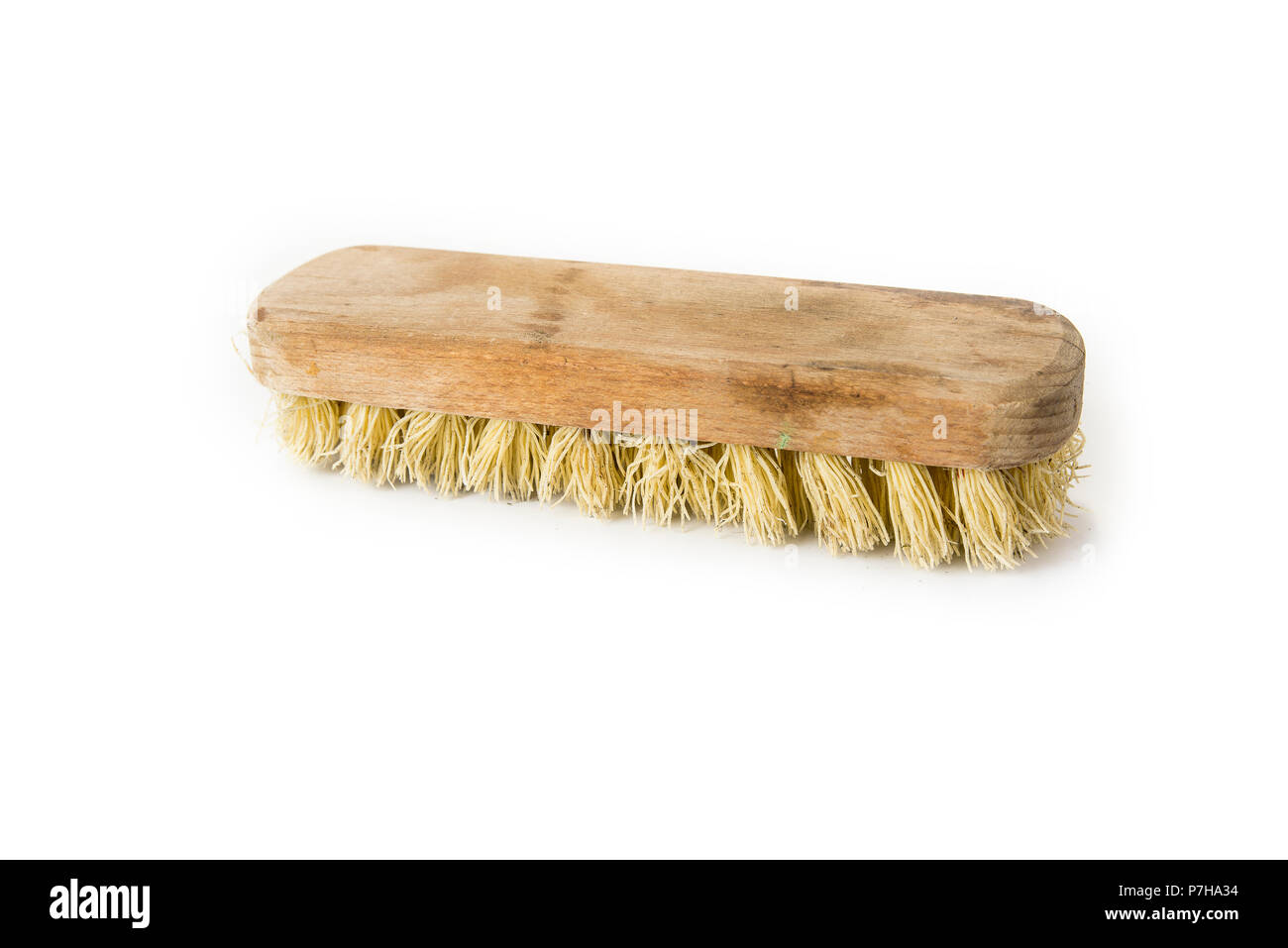 Old Wooden Floor Brush For Cleaning The Dirt On The White Stock