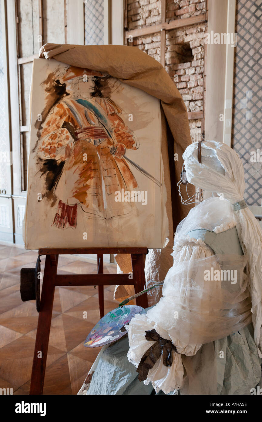 Mannequin wearing paper 18th century style dress by easel Stock Photo