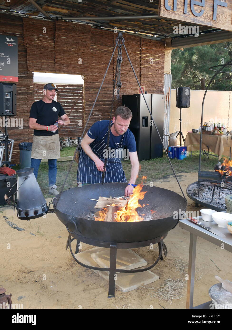 Open fire cooking demonstration at Taste of London food festival, London, England. Stock Photo