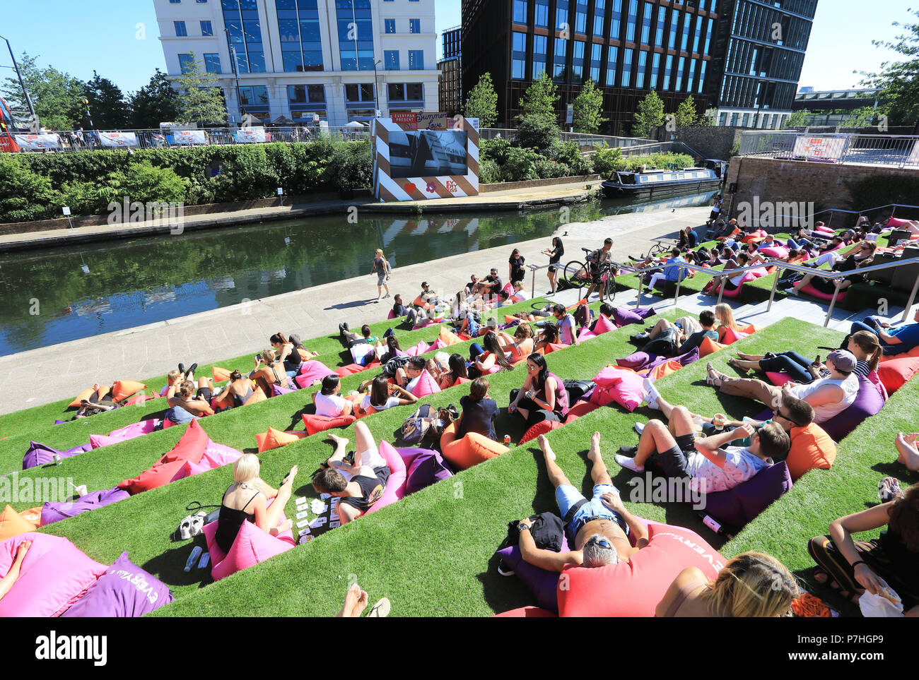People Relaxing On The Steps At Granary Square Kings Cross To Watch The Everyman Summer Of Love Film Festival In North London Uk Stock Photo Alamy