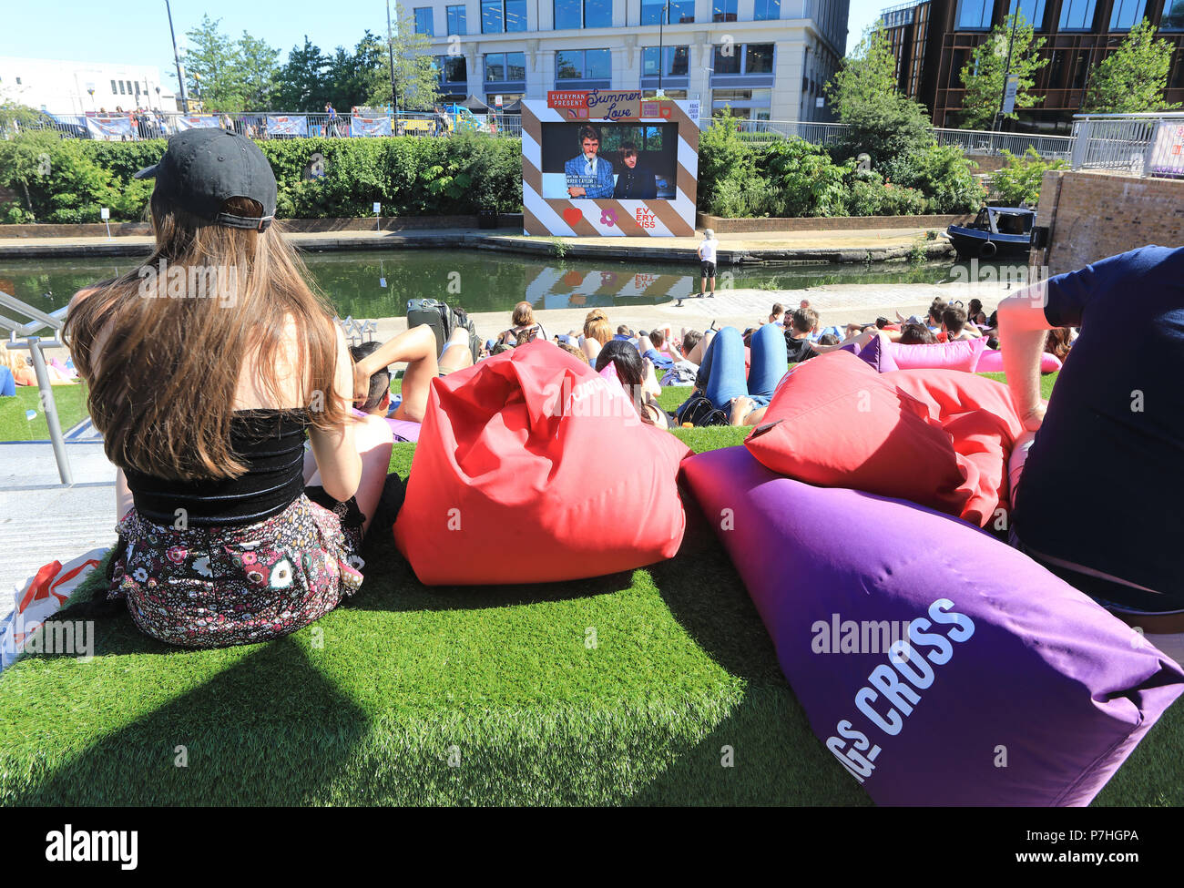 People Relaxing On The Steps At Granary Square Kings Cross To Watch The Everyman Summer Of Love Film Festival In North London Uk Stock Photo Alamy
