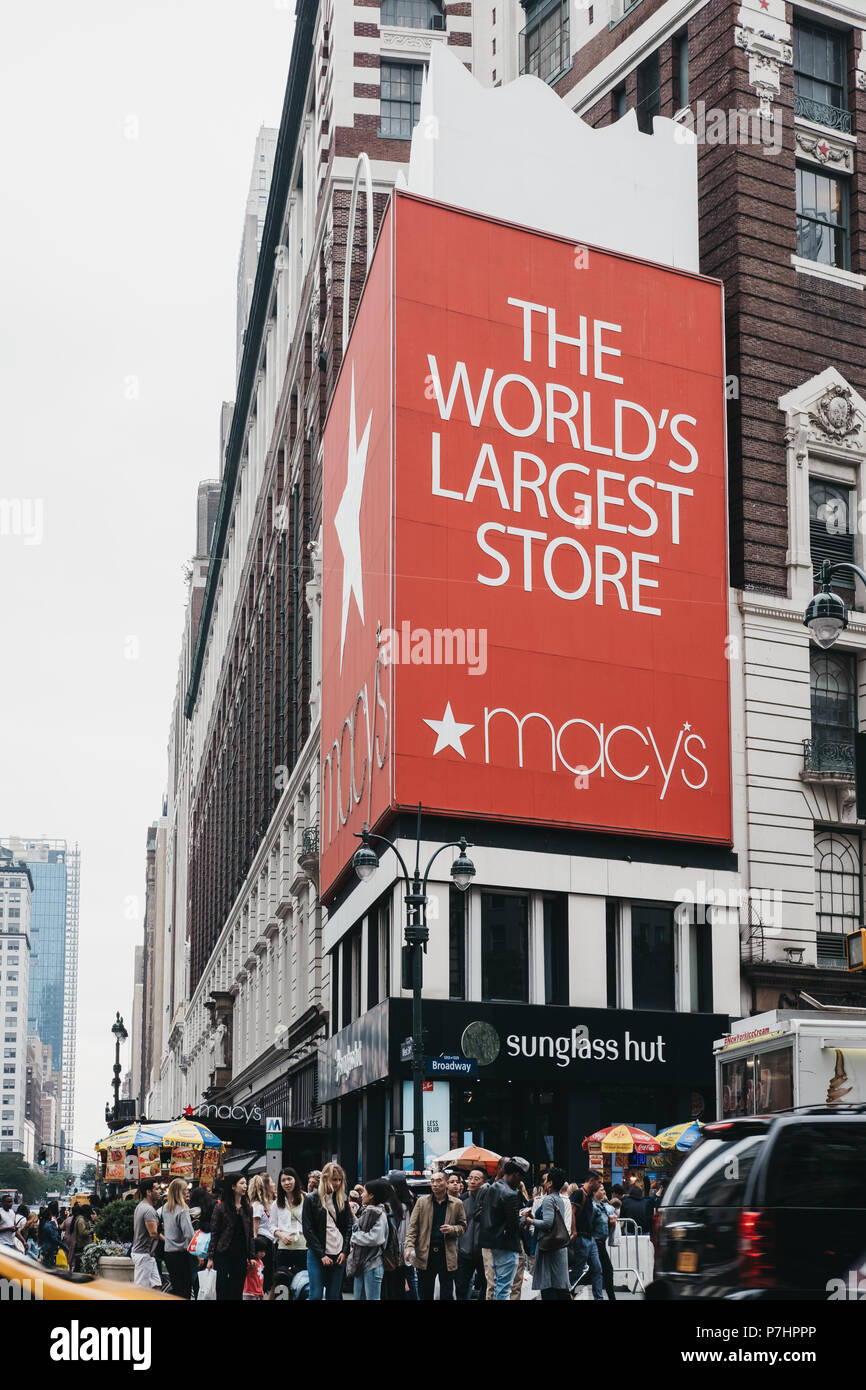 People walking on a street in from of Macy's in Manhattan, New York