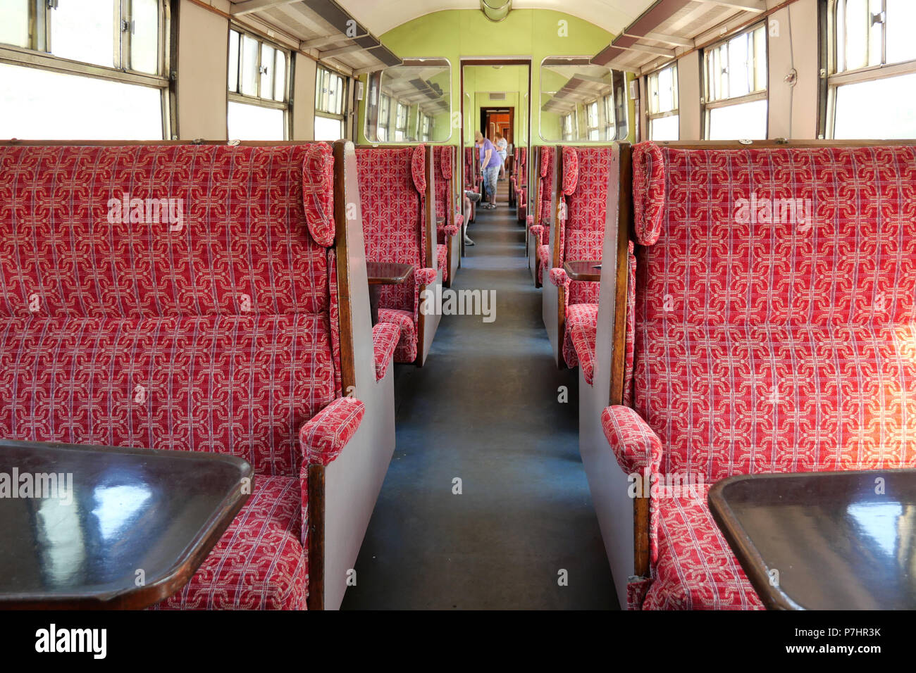 Passenger Carriage with people being seated and chatting. July 03 2018 - Carrog, Wales, UK. - Rail Station. Stock Photo