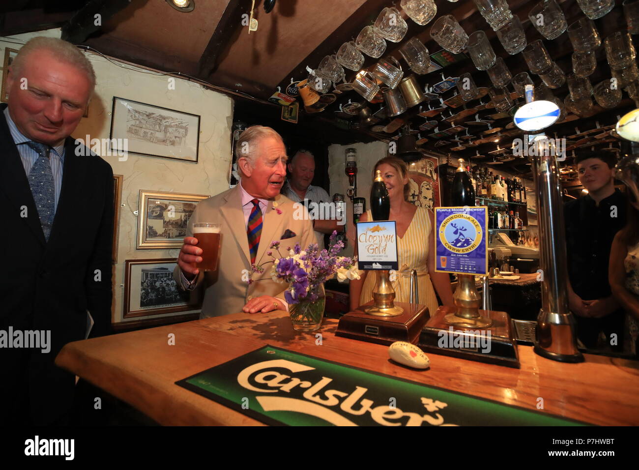 The Prince of Wales enjoys a pint of Snowdonia ale in the Old Stag pub in Llangernyw, Abergele during his five day visit to Wales. Stock Photo
