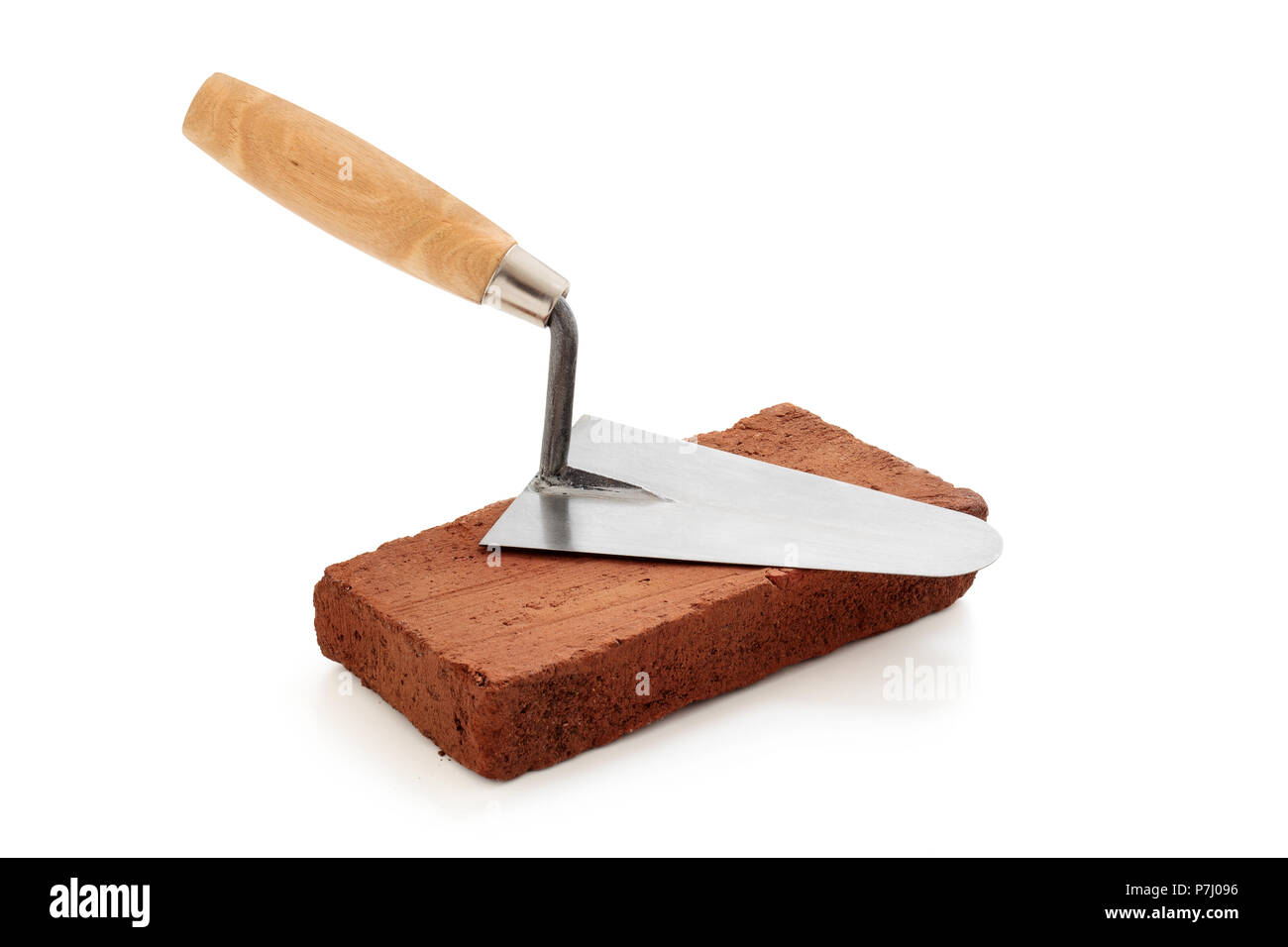 Brick and trowel isolated on white background. Stock Photo