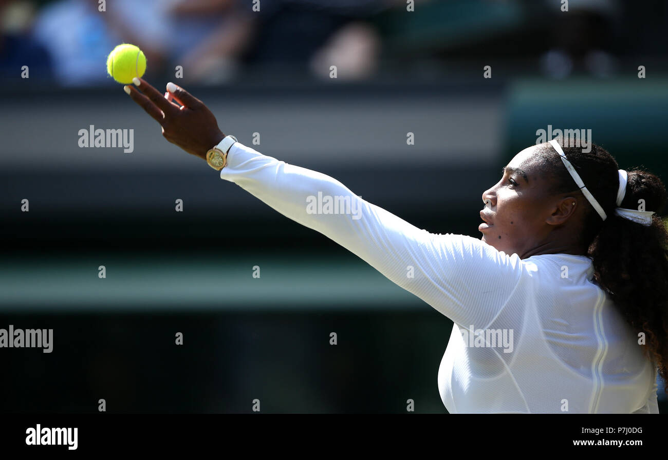 Serena Williams serves on day five of the Wimbledon Championships at the All England Lawn Tennis and Croquet Club, Wimbledon. Stock Photo