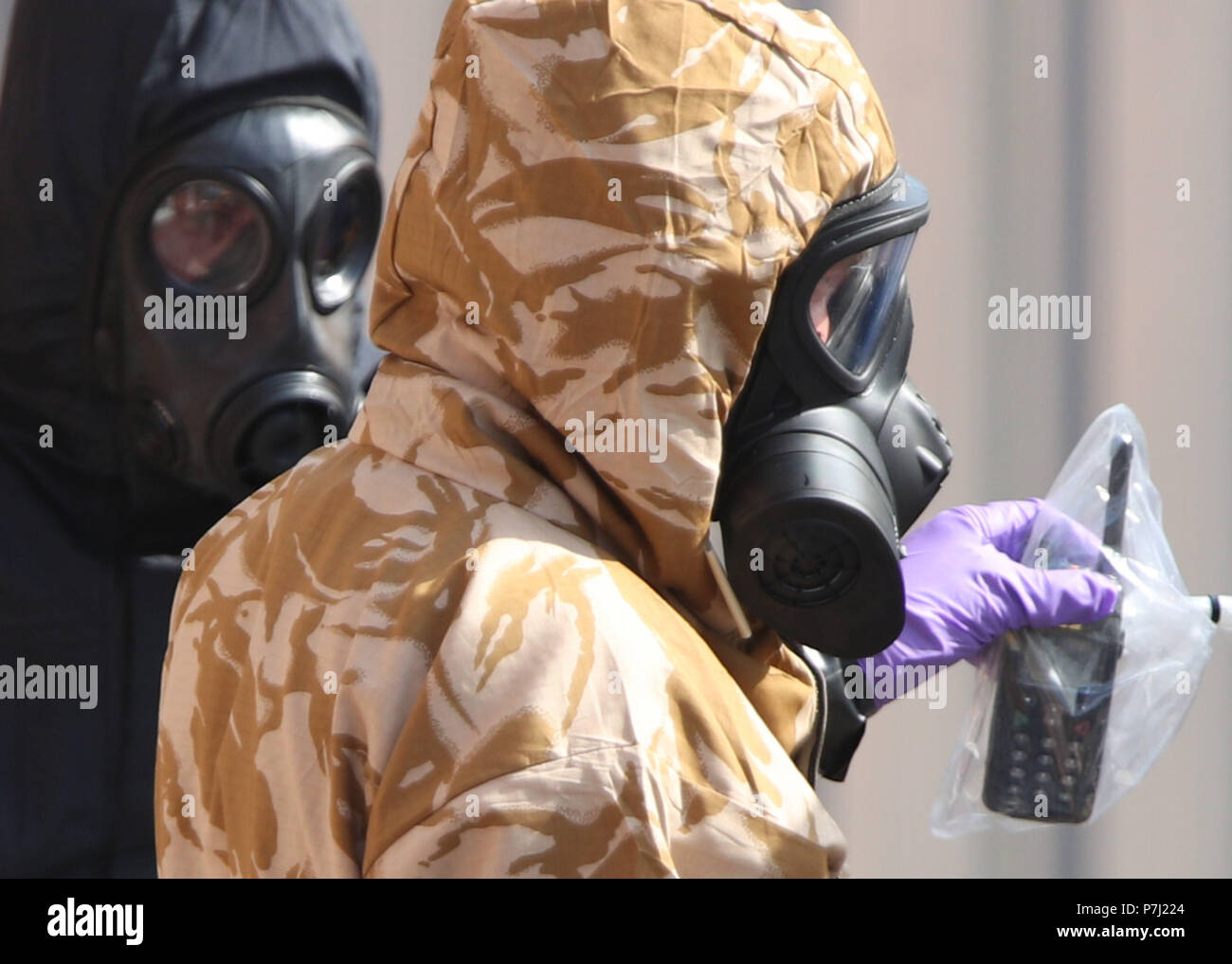 Investigators in chemical suits work behind screens erected in Rollestone Street, Salisbury, Wiltshire, where counter-terrorism officers are investigating after a couple were left in a critical condition when they were exposed to the nerve agent Novichok. Stock Photo