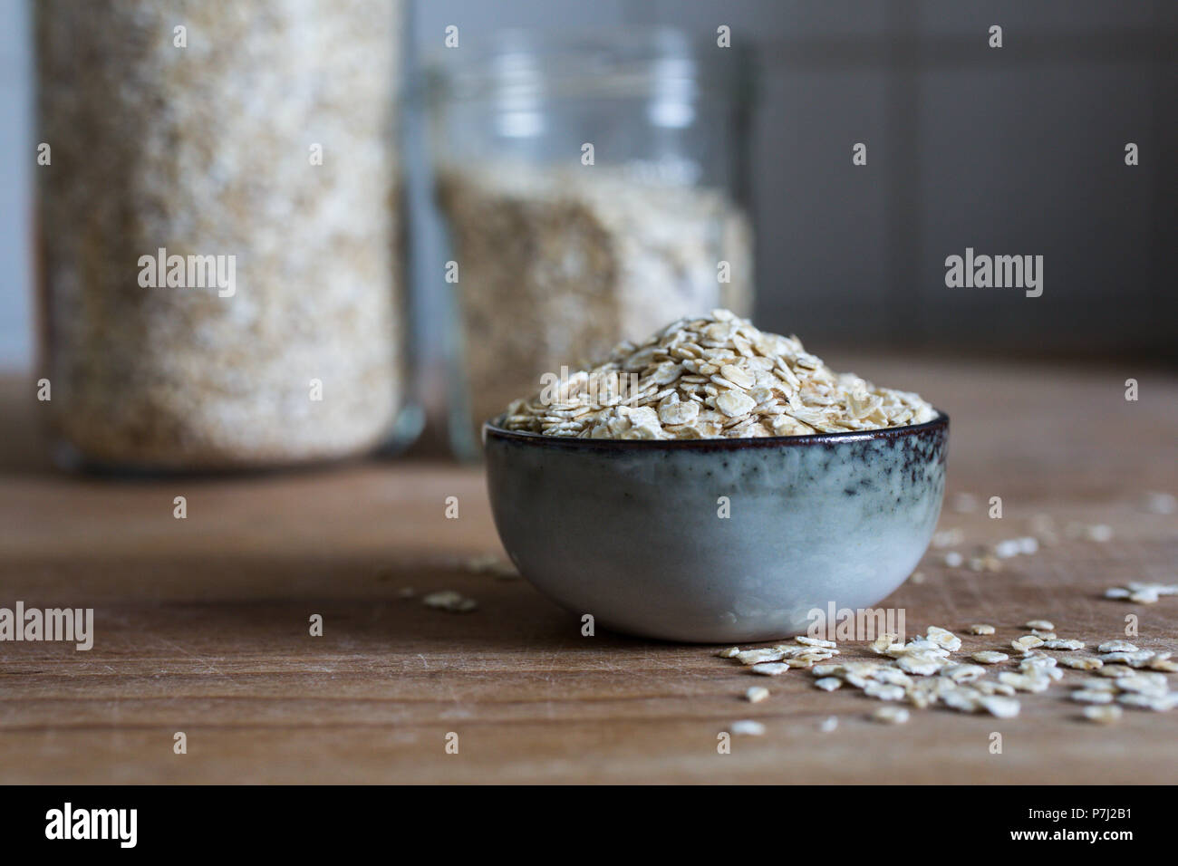 fiber source organic porridge oats for whole food diet on wooden table Stock Photo