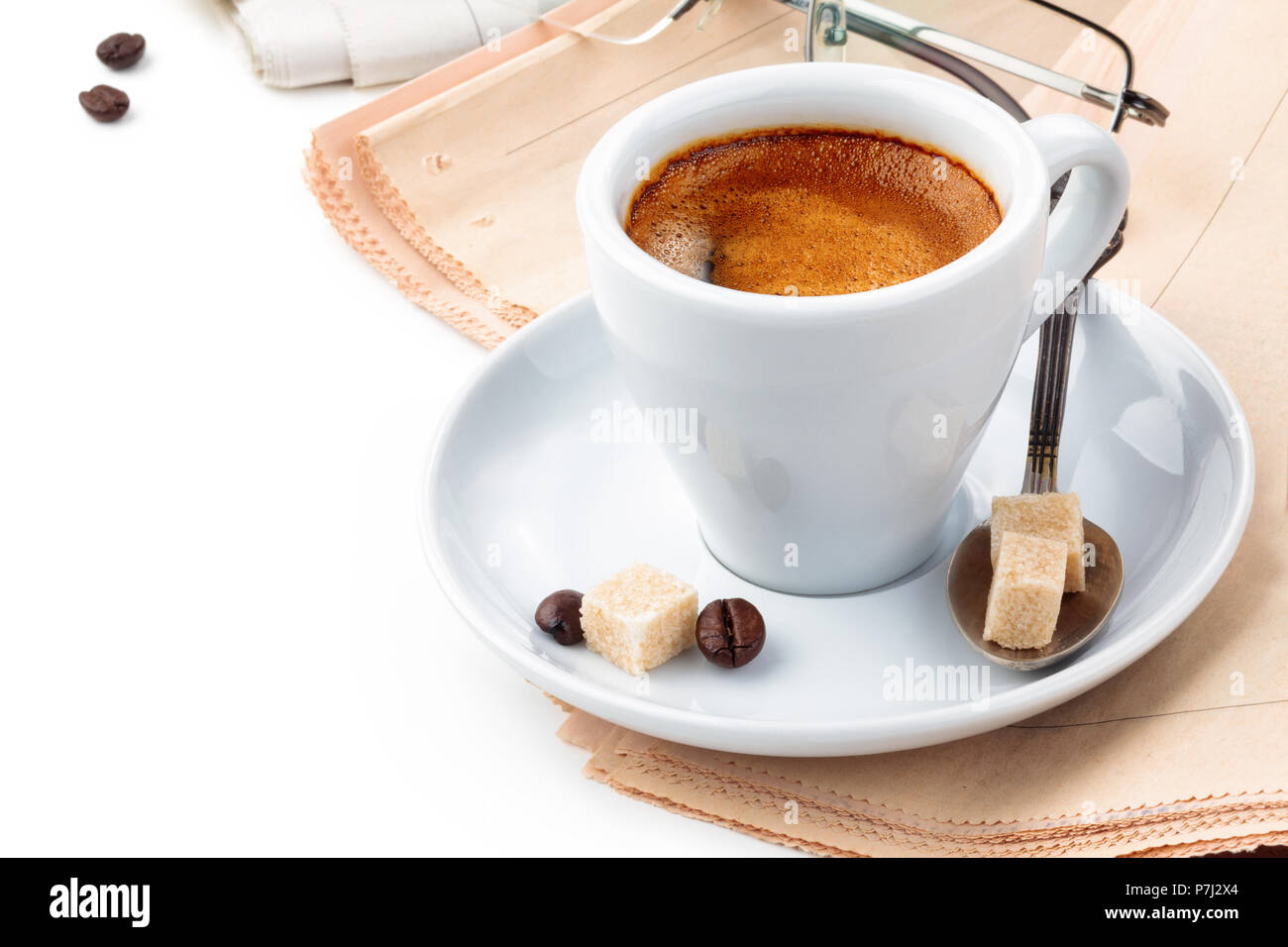 Coffee and newspapers isolated on white background. Stock Photo