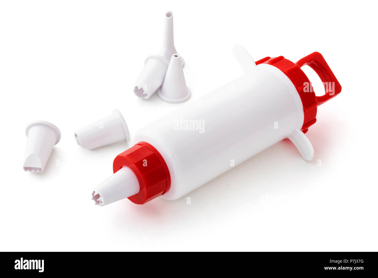 Closeup shot of culinary syringe isolated on white background Stock