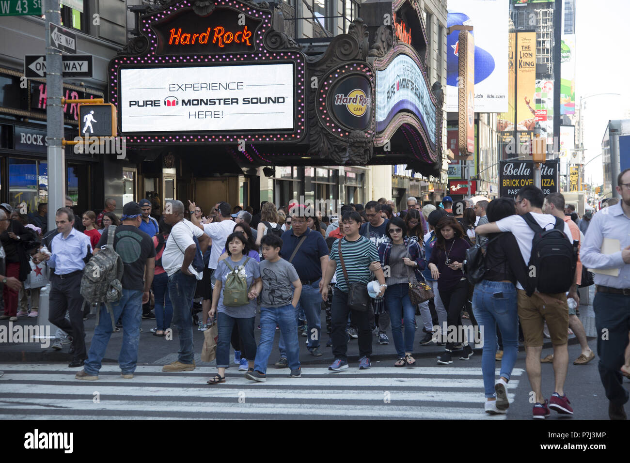 Tourists on 7th Avenue in Times Square on the first official day of