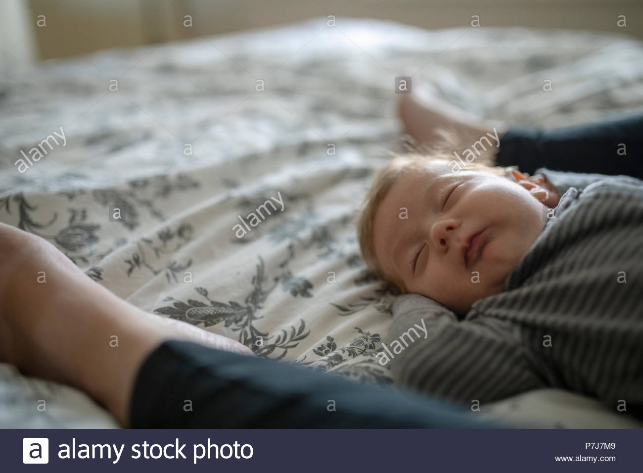 Boy sleeping on bed hires stock photography and images Alamy