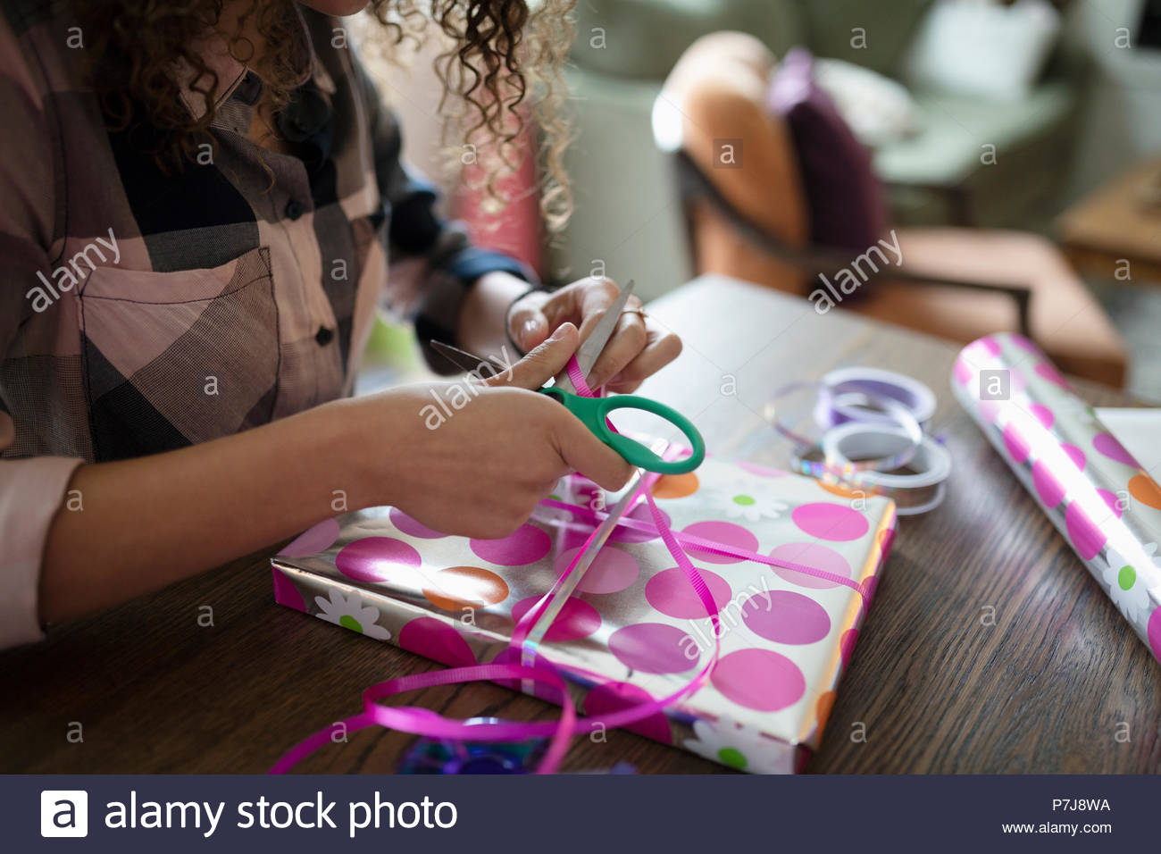 Teenage girl wrapping birthday gift Stock Photo Alamy