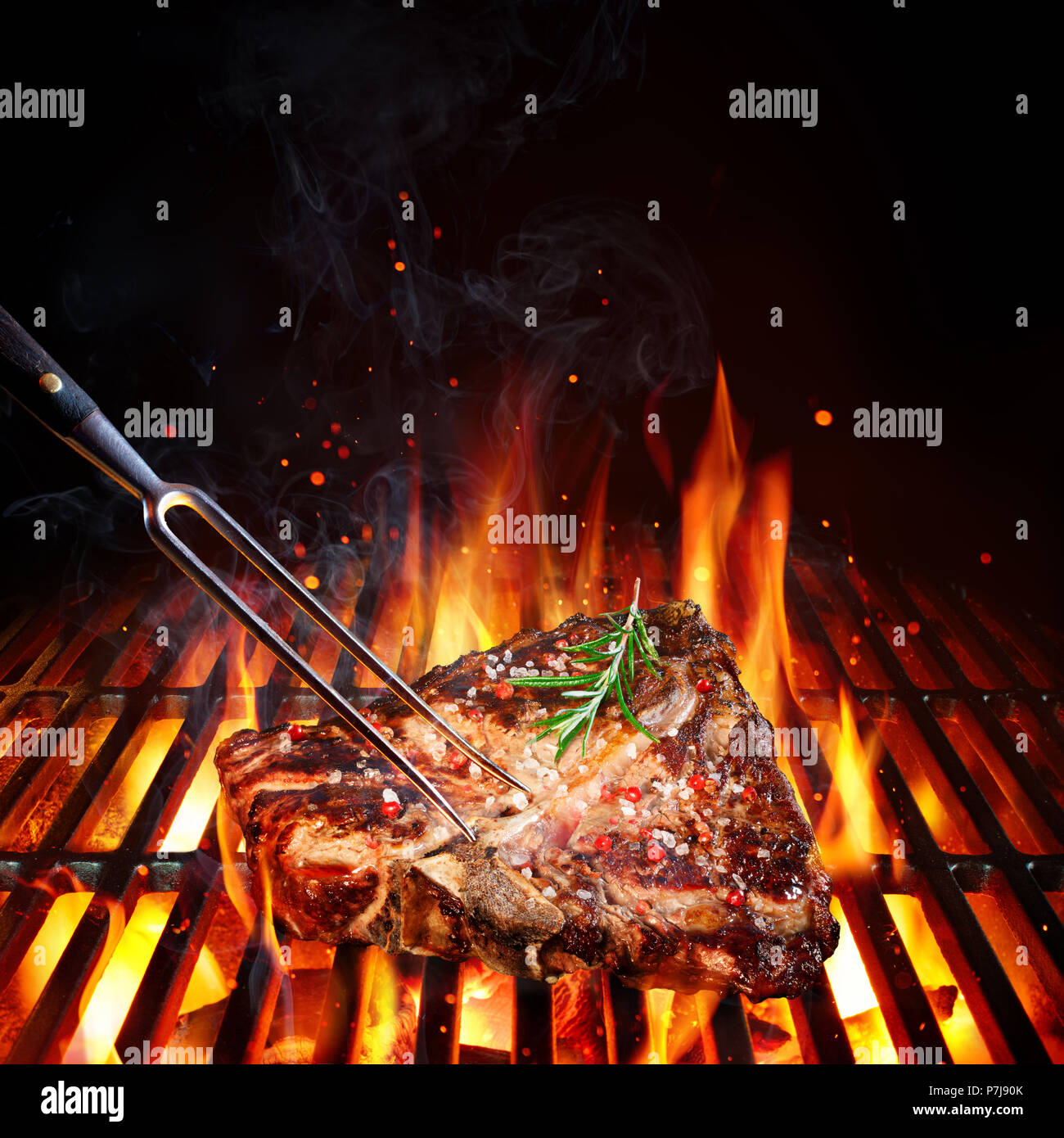 TBone Steak Porterhouse On Grill With Rosemary And Pink Pepper Stock Photo Alamy