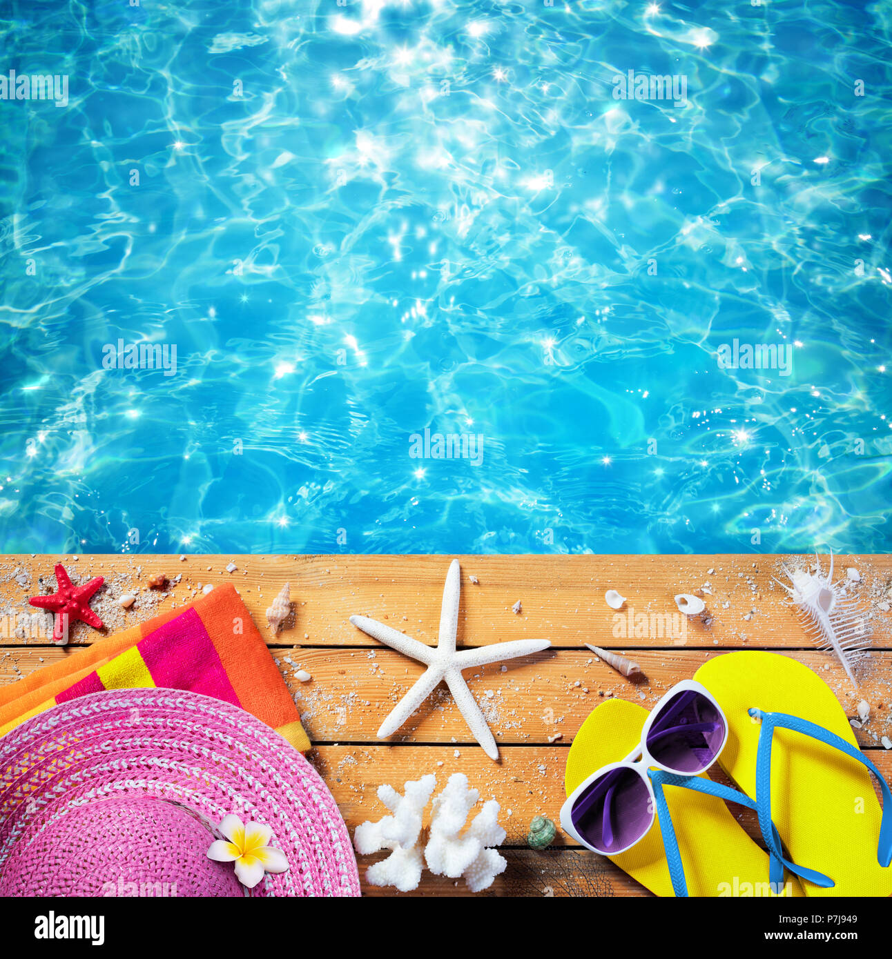 Summer Vacation - Beach Accessories With Pool background Stock Photo