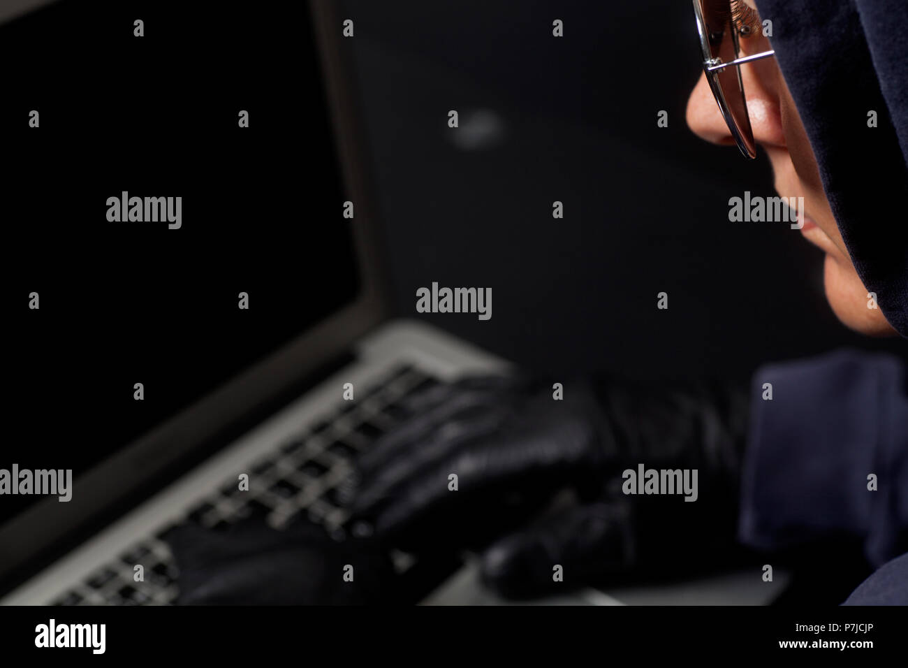 Hacker on a laptop.Concept of internet criminal hacking Stock Photo