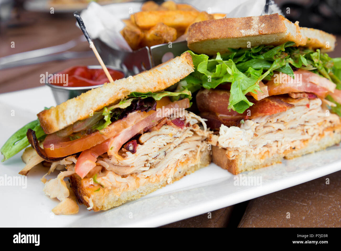 Delicious turkey club sandwich on toast with bacon, lettuce and tomato Stock Photo Alamy