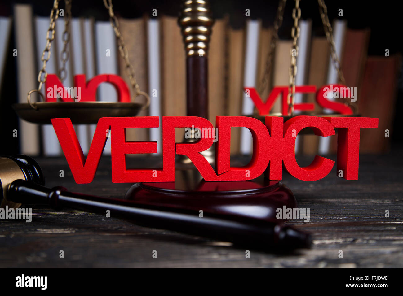 Law theme, mallet of the judge, justice scale, wooden desk background