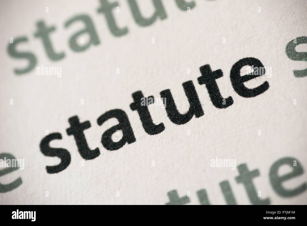 word statute printed on white paper macro Stock Photo Alamy