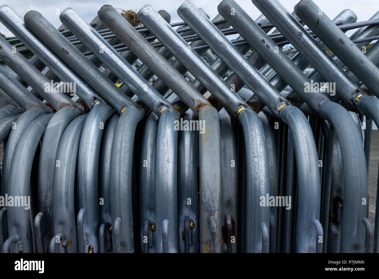 steel safety barriers stacked together Stock Photo