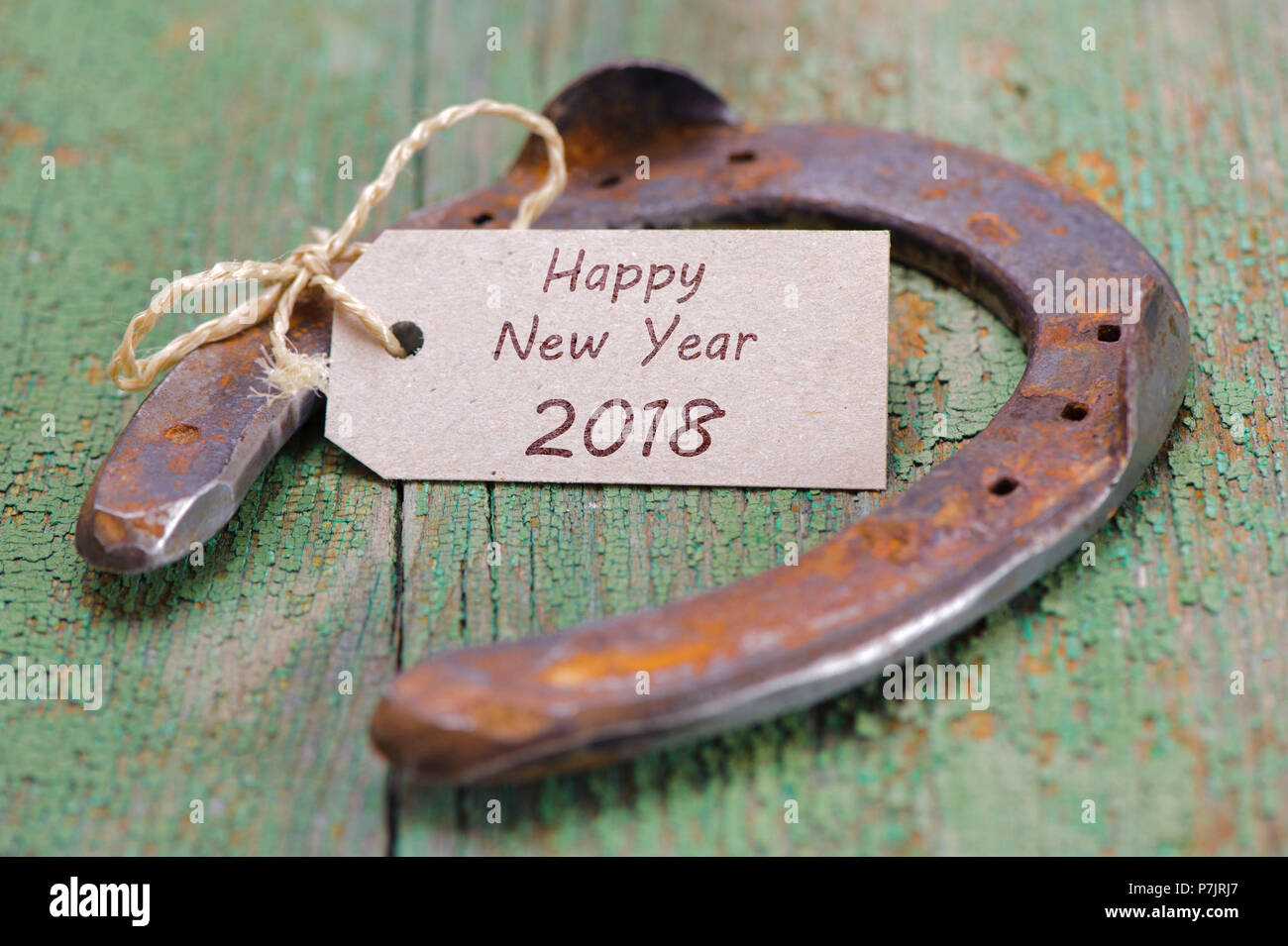 Horseshoe with Happy New Year wishes 2018 Stock Photo