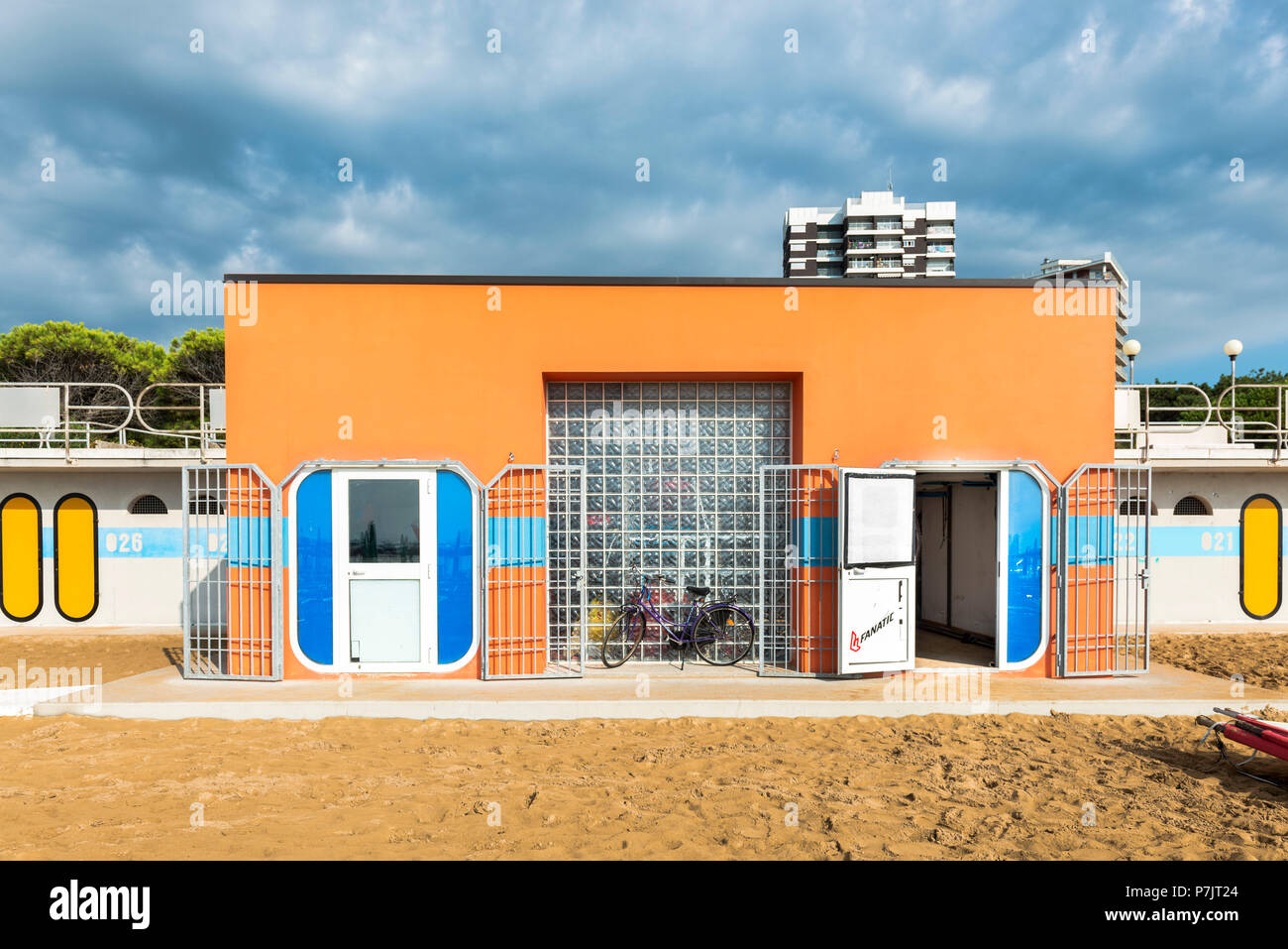 View of a small orange beach shop, architecture on the beach of Lignano Stock Photo