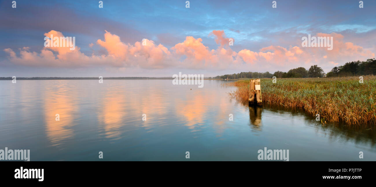 Germany, Mecklenburg-Western Pomerania, Fischland-Darß-Zingst, Darss peninsula, Wieck am Darß, sunrise at Bodstedter Bodden, clouds in the morning light Stock Photo