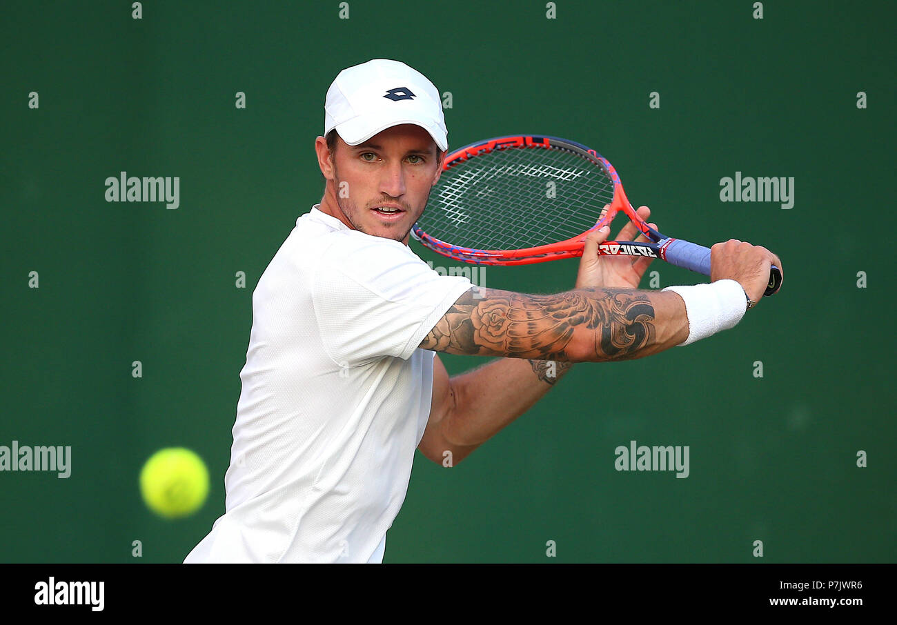 Dennis Novak in action on day five of the Wimbledon Championships at the All England Lawn Tennis and Croquet Club, Wimbledon Stock Photo