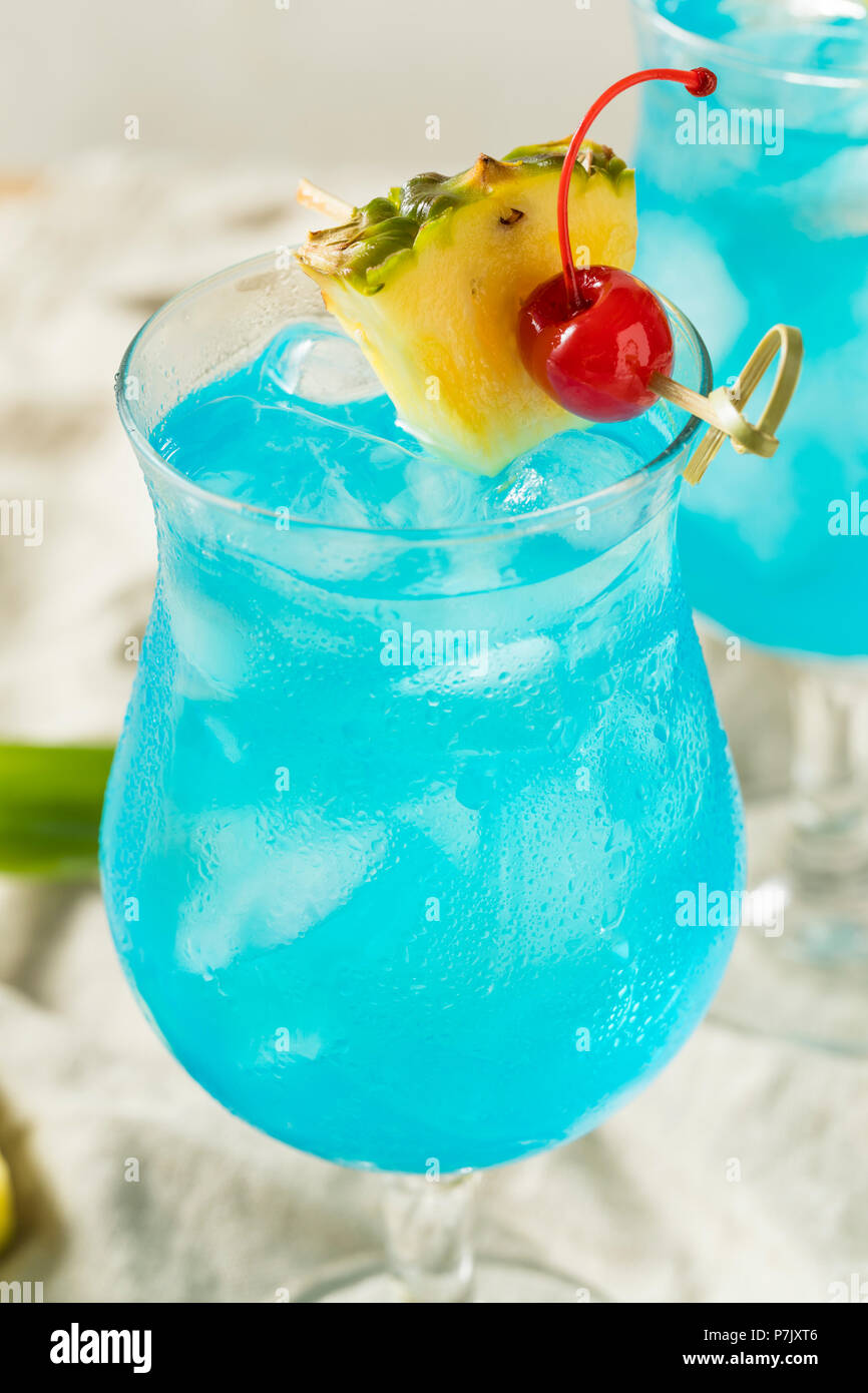 Boozy Blue Hawaii Hurricane Cocktail with Rum and Pineapple Stock Photo