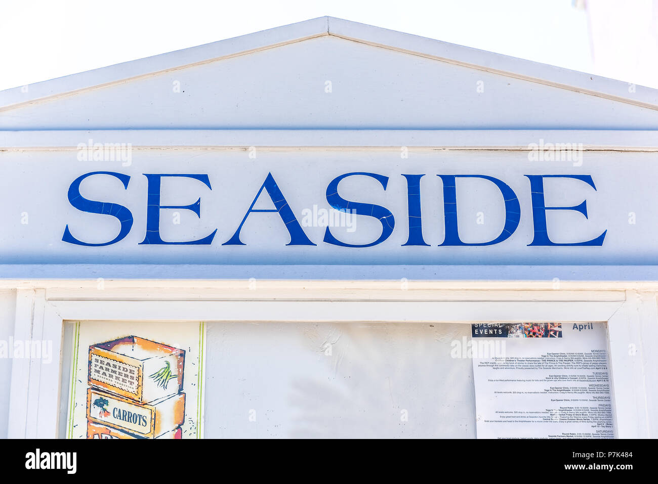 Seaside, USA - April 25, 2018: Closeup of city town village sign by beach during sunny day in Florida panhandle gulf of mexico Stock Photo