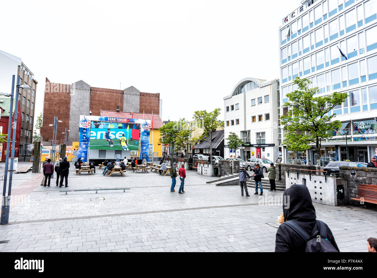 Reykjavik, Iceland - June 19, 2018: Ingolfur Ingolfstorg Square, with signs for HM Torgid, large screen tv television, people watching world cup FIFA  Stock Photo