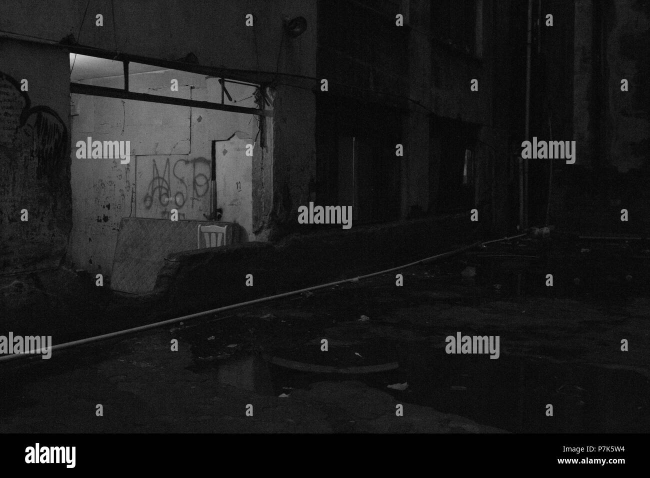 Huge window in now used as entrance in a condemned abandoned building ...