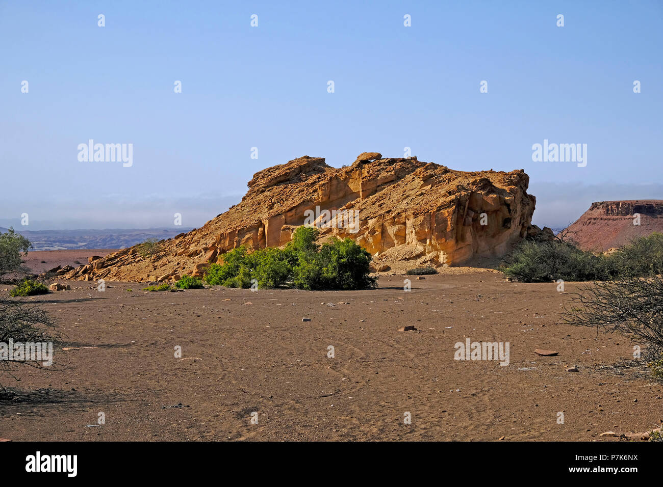 freestanding, highly eroded sandstone cliffs in desert landscape Stock Photo