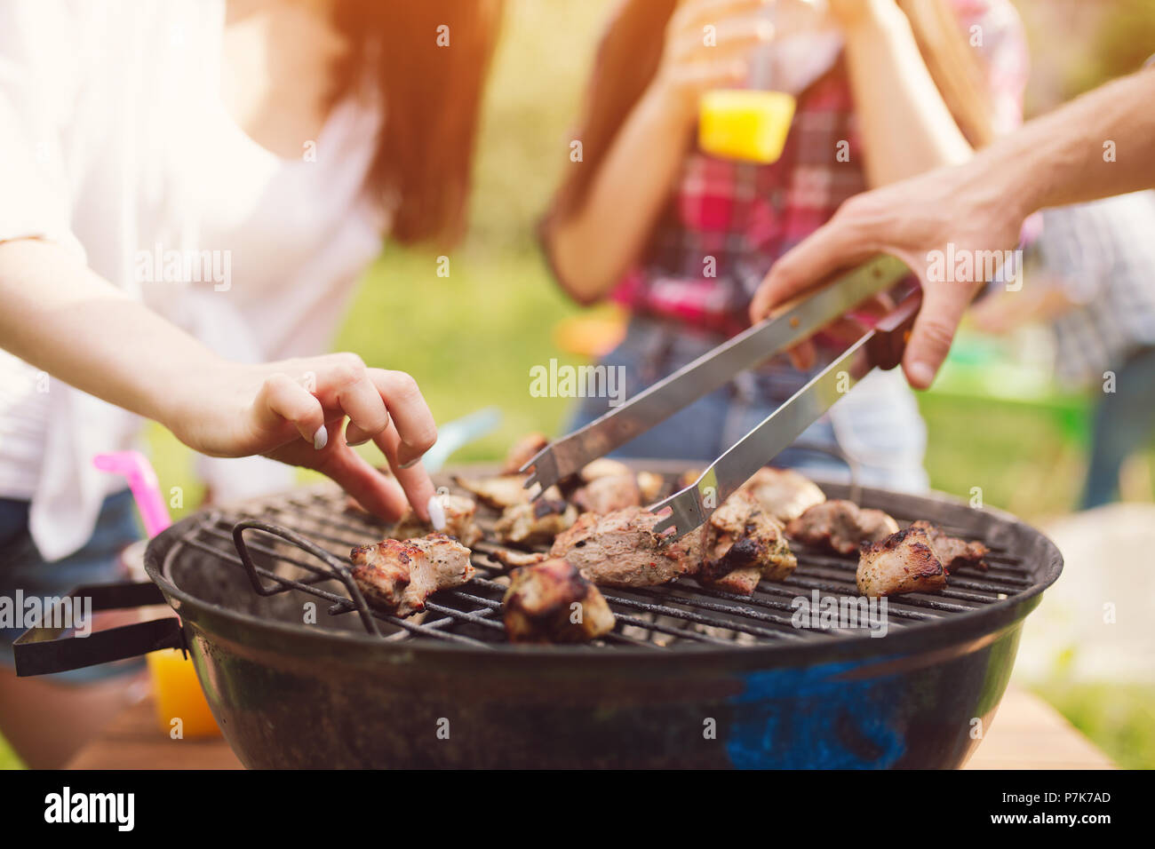 Meat frying on grill outdoors Stock Photo Alamy