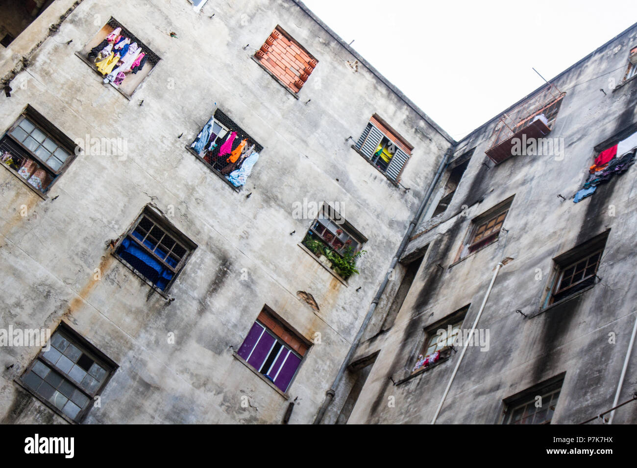 Slum Window A ruined abandoned c shape building with square windows in San Paolo ...