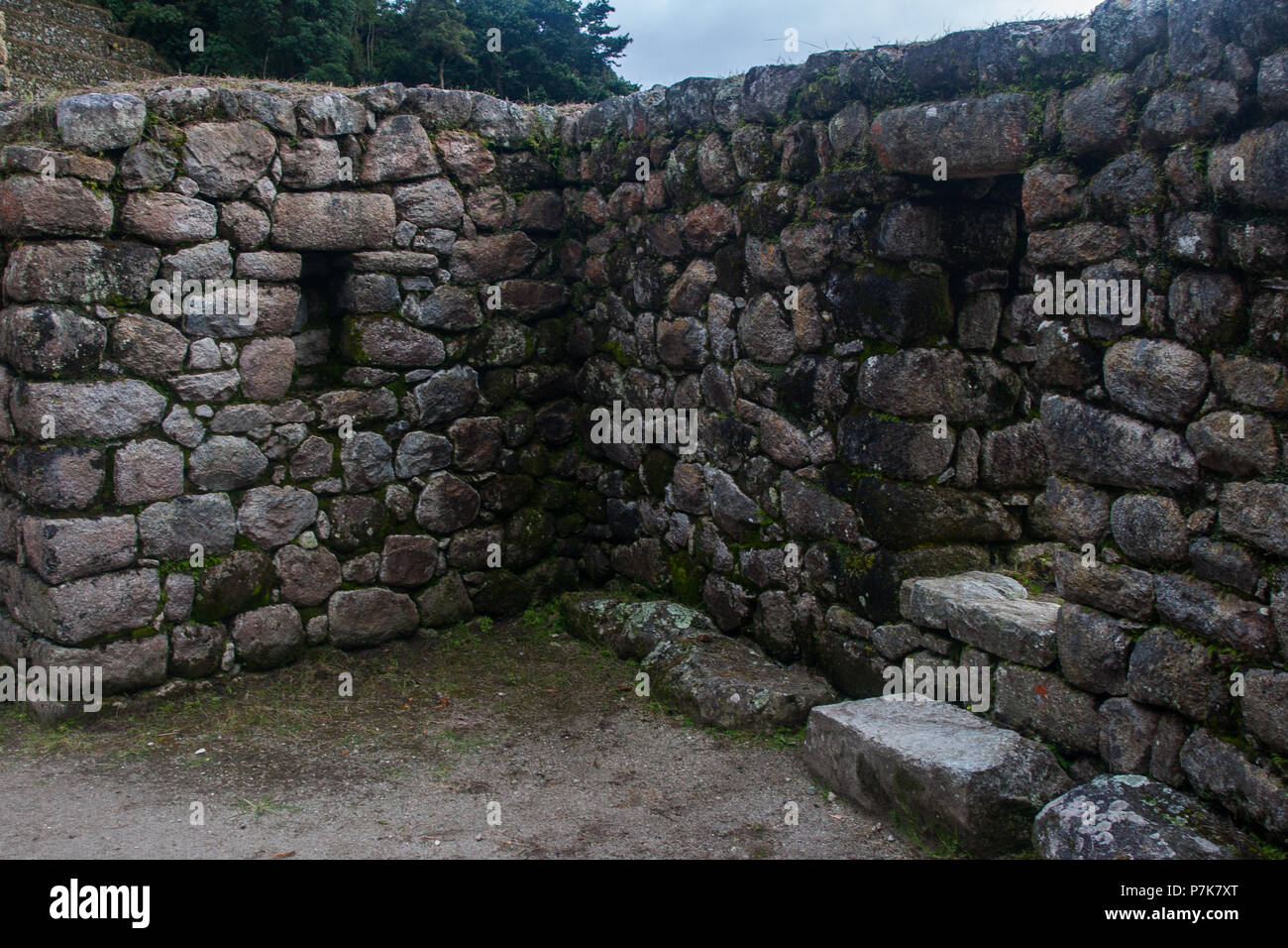 Stone magical ancient ruins along the paved path Inca Trail to Machu ...