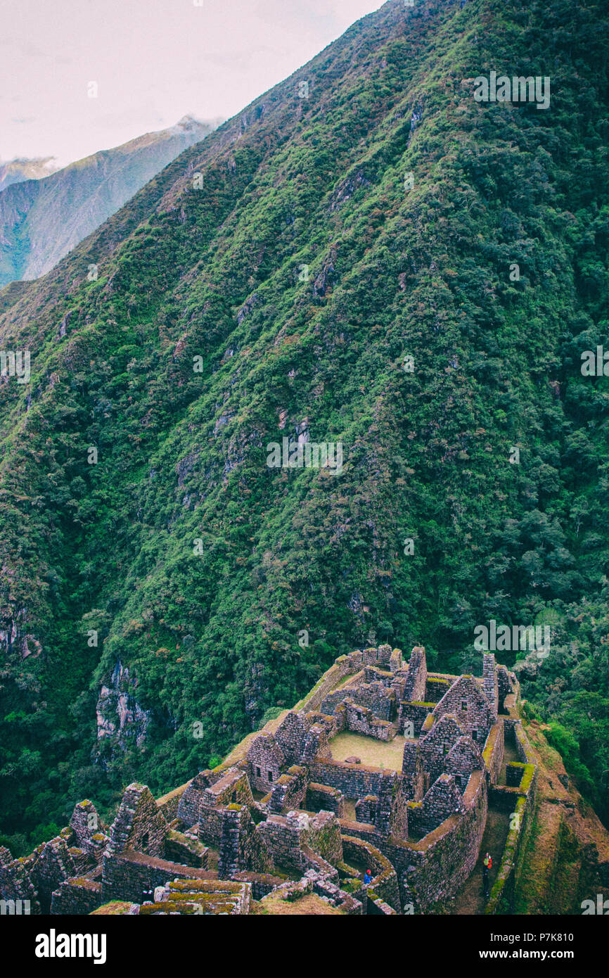 Ancient stone ruins of an Inca town on the Inca Trail in the Andes ...