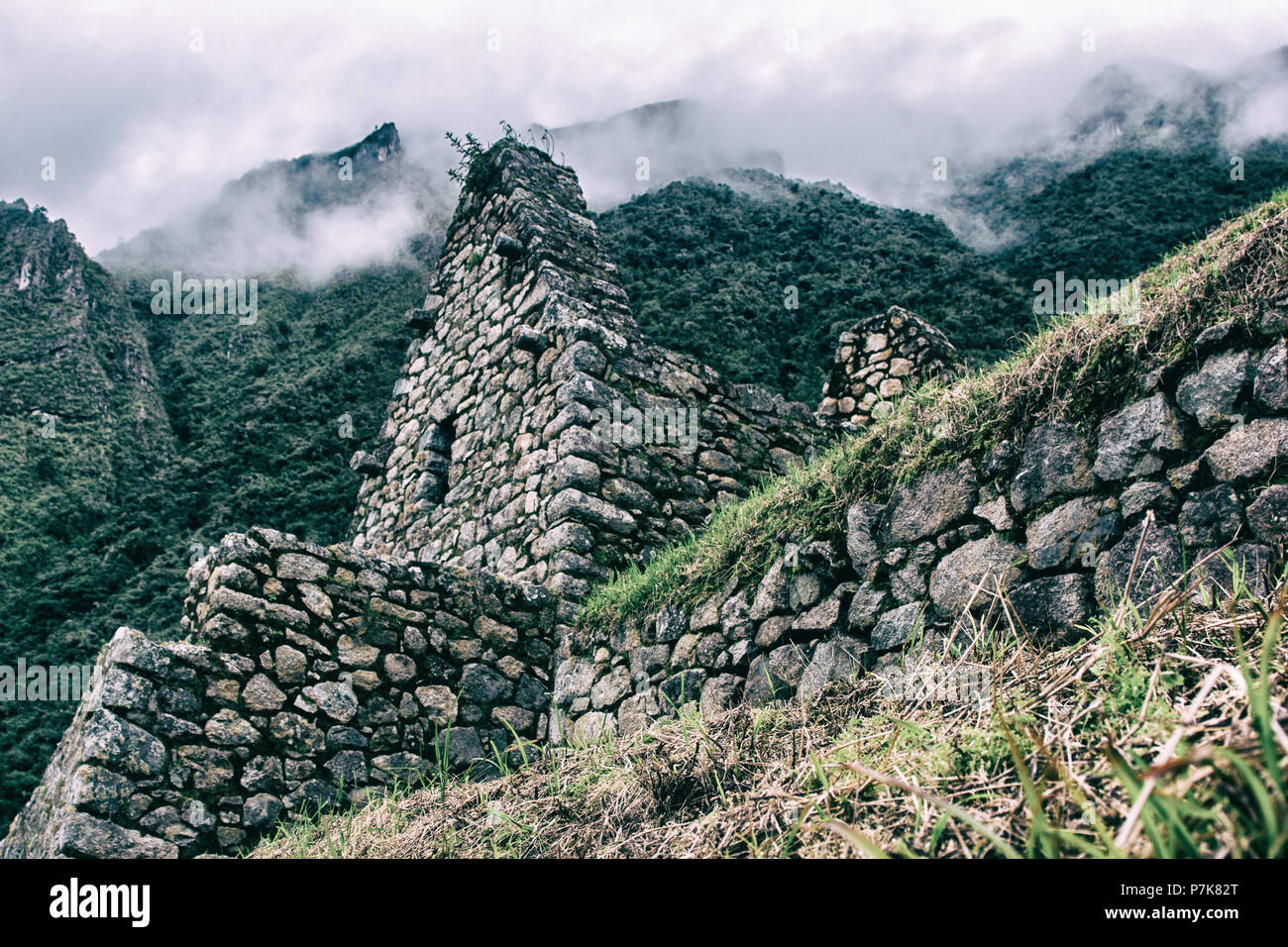 Ancient stone ruins of an Inca town on the Inca Trail in the Andes ...