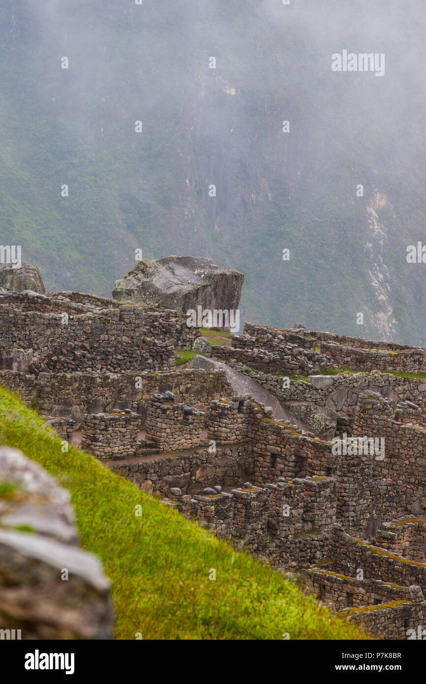 Vertical view of Machu Picchu stone ruins lost in the wild nature of ...