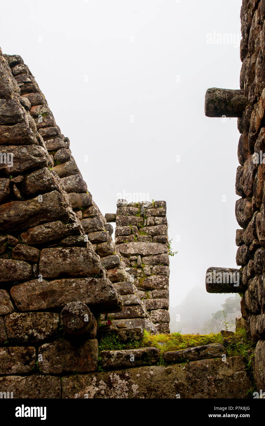 Stone magical ancient ruins along the paved path Inca Trail to Machu ...