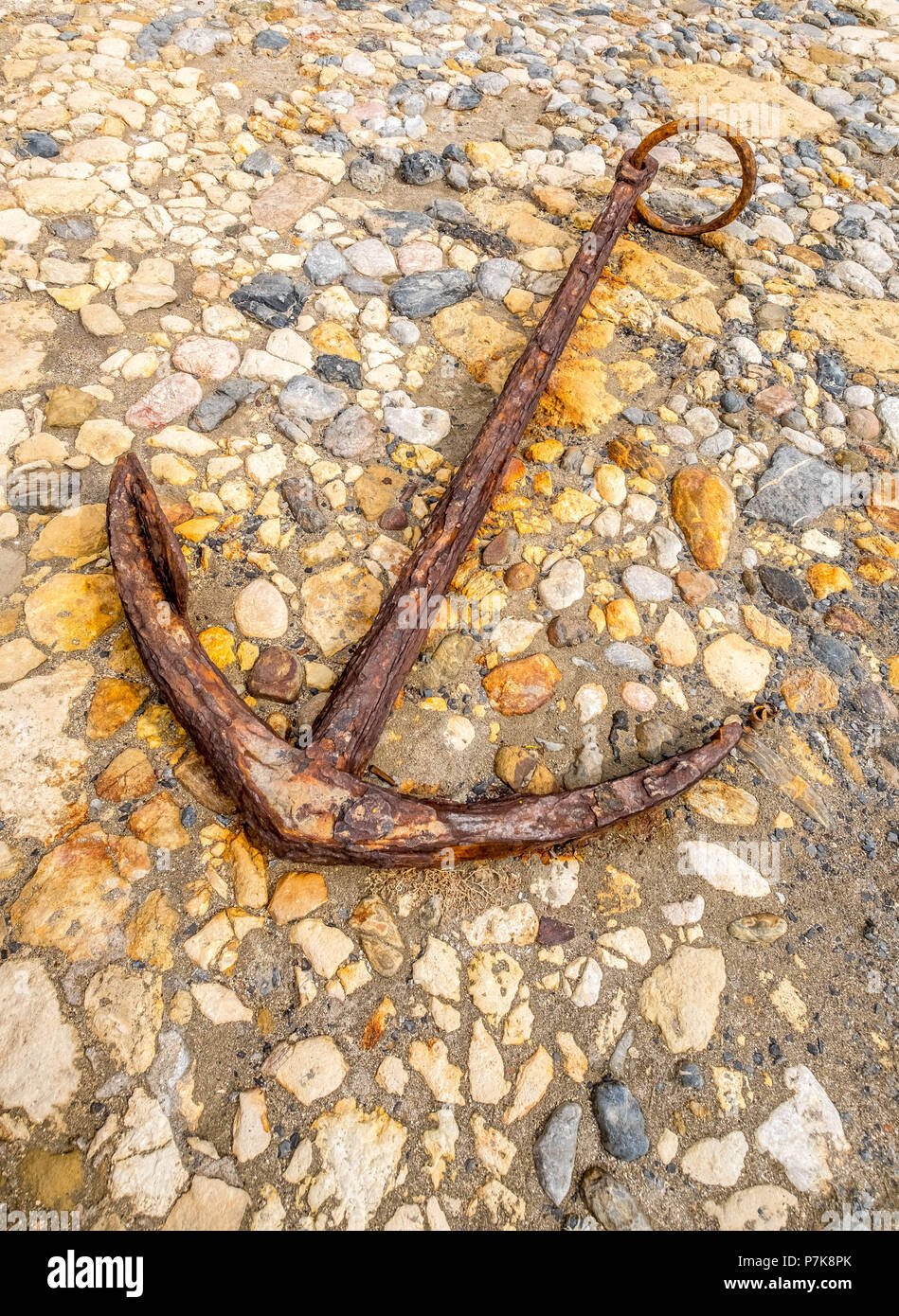 rusty anchor lying on the stones in front of the fortress Koules or ...
